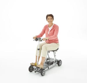 lady sitting on mlite mobility scooter